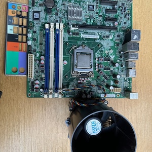 May include: A set of three ceramic mugs with a speckled, matte finish. The mugs are in shades of cream, light gray, and dark gray. Each mug has a simple, minimalist design, perfect for coffee or tea.