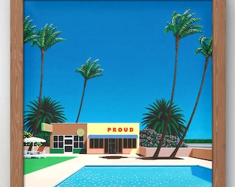 May include: A framed art print depicting a tropical scene with palm trees, a swimming pool, and a building with the word "PROUD" on it. The artwork features a bright blue sky and a retro aesthetic.