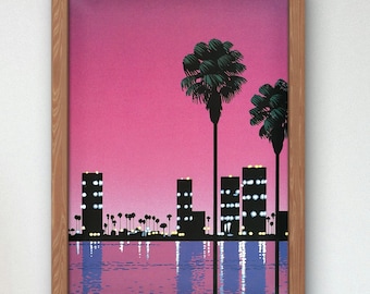 May include: A framed print of a city skyline with palm trees and a pink sunset reflected in the water.