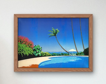 May include: A framed print of a tropical scene with a swimming pool, palm trees, and a white umbrella. The sky is blue and the water is a vibrant blue.
