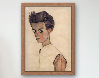 May include: A framed watercolor painting of a man with dark hair and a white shirt. The man is looking to the left of the image. The painting is on a light beige background.