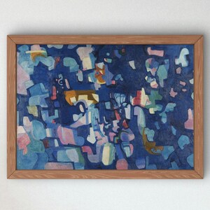 May include: Abstract painting in a wooden frame. The artwork features a dark blue background with various shapes in shades of blue, pink, and yellow. The painting is rectangular and mounted in a light brown wooden frame.