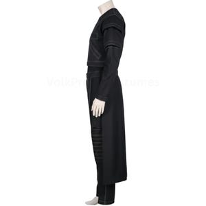 May include: A black costume with white stitching details. The outfit includes a long coat, pants, and a top with shoulder accents. The costume is displayed on a mannequin against a white background. The costume is likely for cosplay or a theatrical performance.