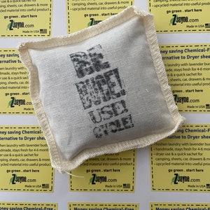 May include: A white fabric pouch with the words "Be Useful" printed in black. The pouch is surrounded by yellow cards with the text "Money saving Chemical-Free Alternative to Dryer sheets" and a list of features. The text "go green. start here" and "ZJayne.com" are also printed on the cards.