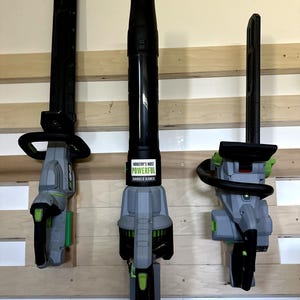 EGO 56V Tool Wall Mount Bundle: Chainsaw, Hedge Trimmer, Leaf Blower