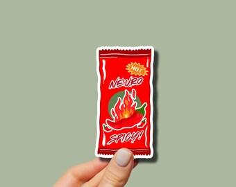 May include: Red and white sticker of a hot sauce packet with a red chili pepper and flames. The packet says "Hot Neuro Spicy!"