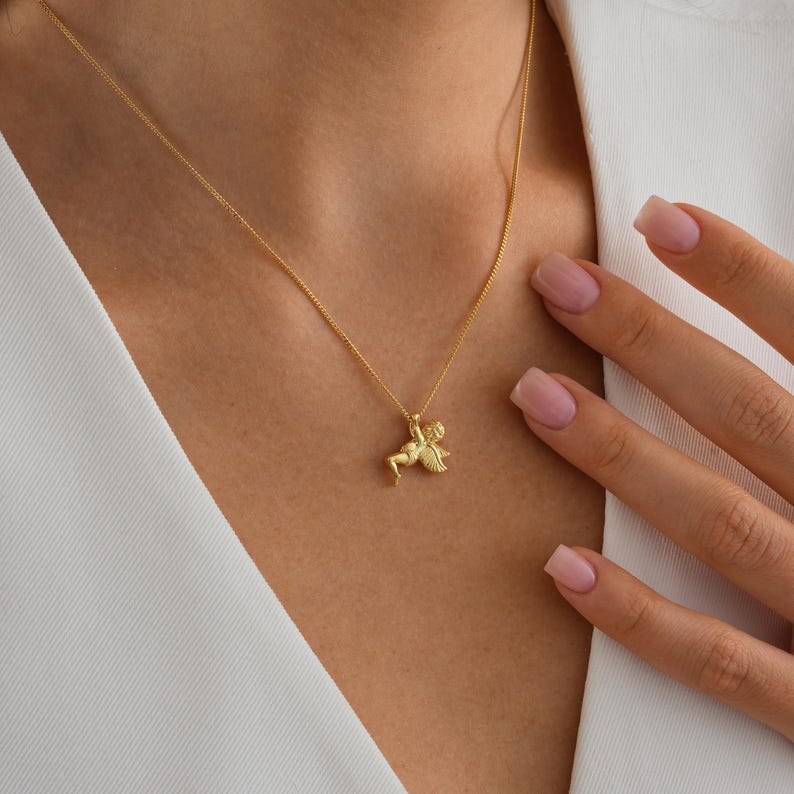 ✨ Guardian Angel Pendant Necklace – Cherub Charm Jewelry ✨  

A beautifully detailed angel pendant symbolizing protection, love, and guidance. This timeless piece makes a meaningful gift for loved ones or a treasured keepsake for yourself.  

💛 Product Details  
• Material: 925K Sterling Silver / 14K Solid Gold  
• Closure: Spring Ring  
• Pendant Size: Approx. 20mm height  
• Sold as: Pendant with chain included  
• Hypoallergenic & safe for sensitive skin