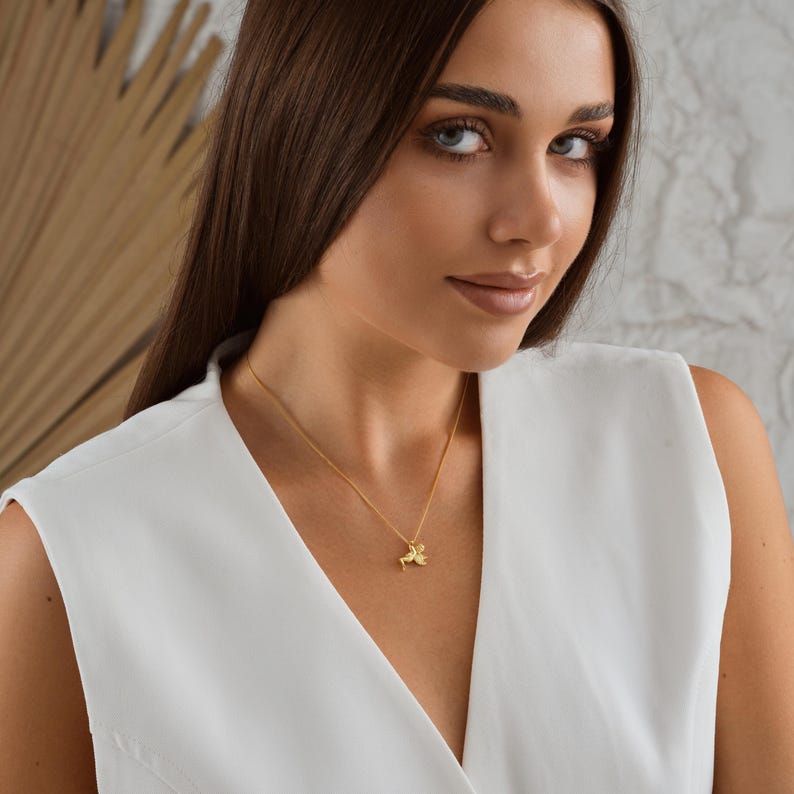 ✨ Guardian Angel Pendant Necklace – Cherub Charm Jewelry ✨  

A beautifully detailed angel pendant symbolizing protection, love, and guidance. This timeless piece makes a meaningful gift for loved ones or a treasured keepsake for yourself.  

💛 Product Details  
• Material: 925K Sterling Silver / 14K Solid Gold  
• Closure: Spring Ring  
• Pendant Size: Approx. 20mm height  
• Sold as: Pendant with chain included  
• Hypoallergenic & safe for sensitive skin