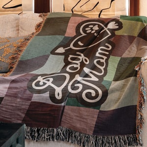 Colorful woven cotton Dog Mom throw blanket featuring retro checkerboard design.