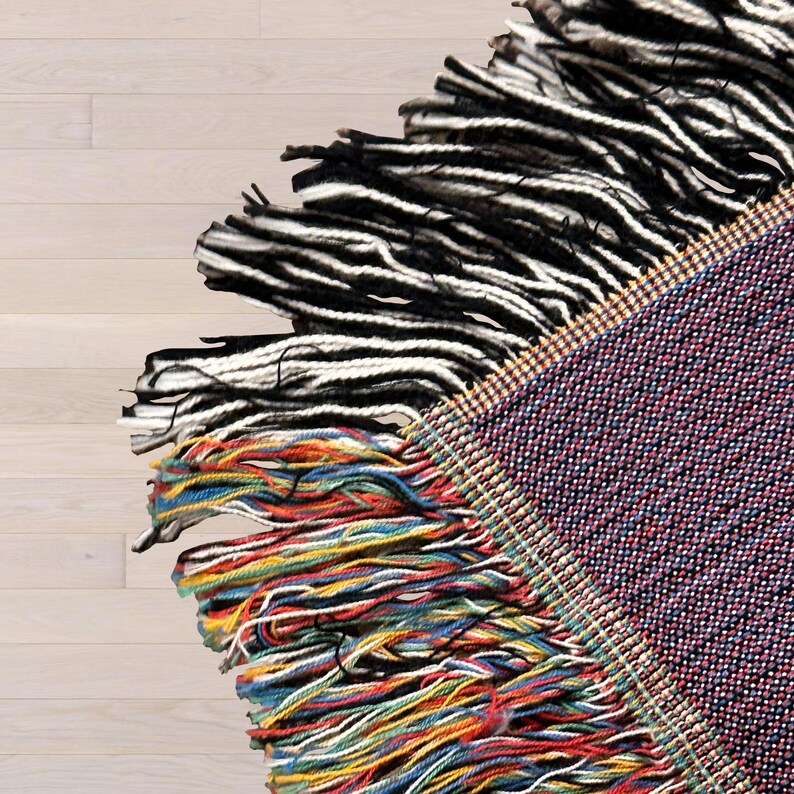 Close up of colorful edge fringe on Dog Mom blanket.