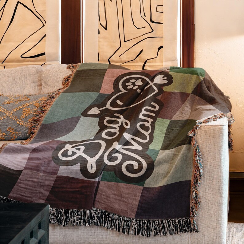Colorful woven cotton Dog Mom throw blanket featuring retro checkerboard design.
