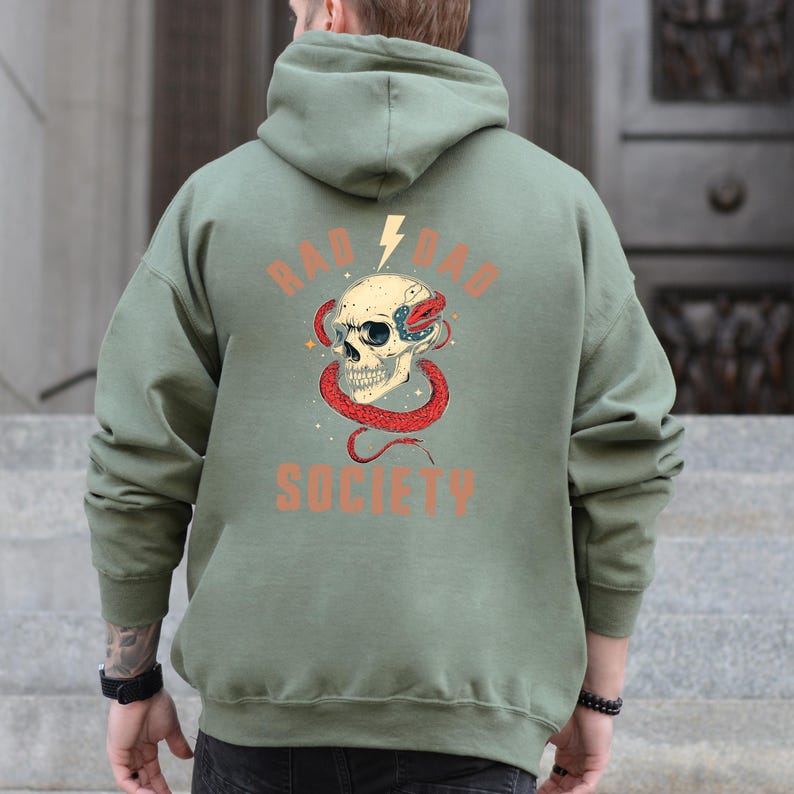 May include: A green hooded sweatshirt with a skull and snake graphic and the text "Rad Dad Society".