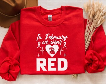 In February We Wear Red Sweatshirt, Heart Disease Awareness Sweatshirt, Support Team Sweater, Red Ribbon Sweatshirt, Heart Warrior Sweaters
