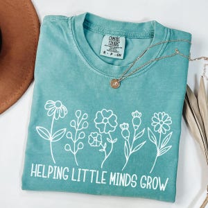 Comfort Colors® Helping Little Minds Grow Shirt, Preschool Teacher Shirt, Kindergarten Shirt, Floral Teacher Shirt, Teacher Appreciation Tee