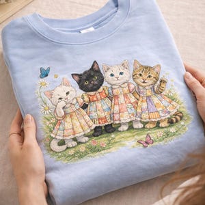 May include: A white ceramic mug with a black handle and the text "But First, Coffee" in a handwritten style. The mug is on a white surface. The mug is 4 inches tall.