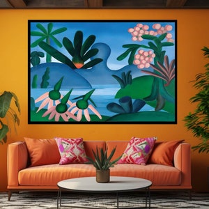 May include: A framed abstract painting with a blue background and green, pink, and white shapes. The painting is hanging on a wall in a living room with a couch and a coffee table.