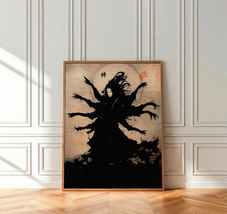 May include: Framed art print featuring a black silhouette of a figure with multiple arms, set against a cream-colored background with a sun-like shape. The Japanese character for "god" is above the figure. The artwork is in a wooden frame.