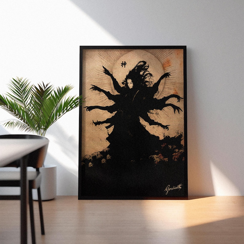 May include: Black framed art print featuring a dark silhouette of a figure with multiple arms, set against a beige background with a circular design. The Japanese character for "God" is at the top. The artist's signature is at the bottom.