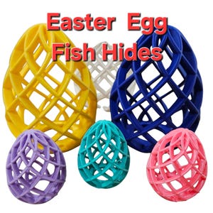 May include: Six Easter egg shaped fish hides in various colors, including yellow, blue, purple, pink, and turquoise. The hides are made of a lattice-like material, allowing fish to swim through them.