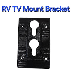 May include: Black plastic RV TV mount bracket with two keyhole slots and four screw holes.