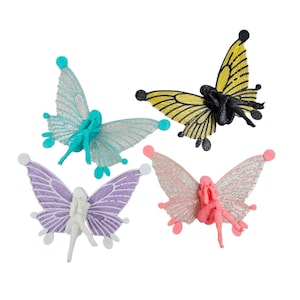 May include: Four colorful fairy figurines with butterfly wings. The fairies are in shades of teal, yellow, pink, and purple. Each fairy has a different pose and wing design, with glitter accents. The figurines are set against a white background.