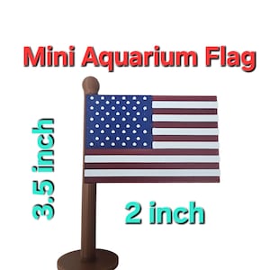 May include: A miniature aquarium flag, 3.5 inches tall and 2 inches wide, featuring the design of the American flag. The flag has a blue field with white stars and red and white stripes. The flag is mounted on a brown pole and base, with the text "Mini Aquarium Flag".