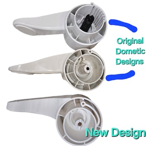 May include: Three white plastic RV toilet flush handles. The top two handles are labeled "Original Dometic Designs". The bottom handle is labeled "New Design".