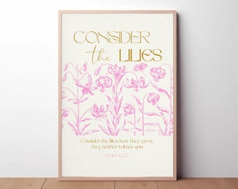 Pode incluir: Uma impressão emoldurada com fundo branco e uma ilustração floral rosa. O texto "CONSIDER the LILIES" está em letras douradas. O texto "Consider the lilies, how they grow: they neither toil nor spin LUKE 12:27" está em letras pretas.