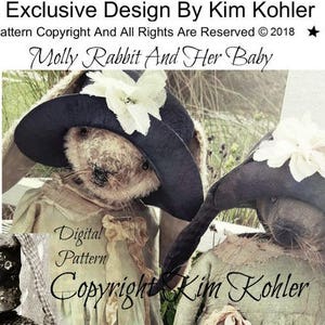 May include: A digital pattern for a doll, featuring two rag dolls dressed in vintage-style clothing. The dolls are wearing hats and have a rustic, whimsical look. The pattern is titled "Molly Rabbit and Her Baby" and is copyrighted by Kim Kohler.