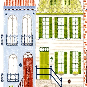 May include: A colorful illustration of three houses with different architectural styles. The first house is blue with red and white striped roof, the second house is white with a green roof and green shutters, and the third house is red brick with a white trim.