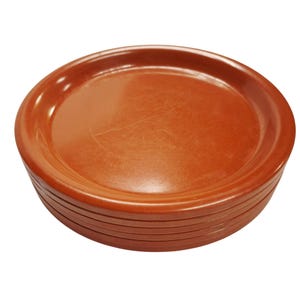 May include: A stack of terracotta-colored, round saucers. Each saucer has a slightly raised rim and a smooth, flat surface. The saucers are made of a durable material and are suitable for use with potted plants.