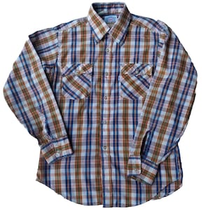 May include: A long-sleeved plaid shirt with a button-down collar and two chest pockets. The shirt is in a blue, brown, white, and red plaid pattern.