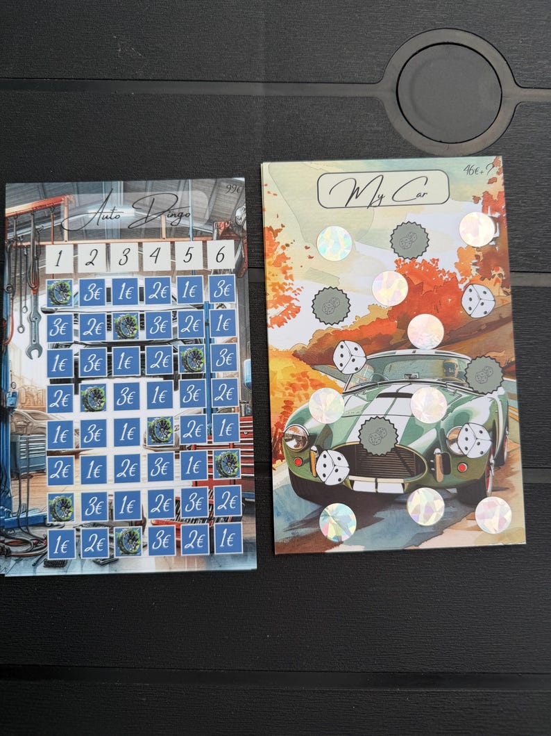 May include: Two rectangular game cards. The left card, titled Auto Dingo, features a grid with numbers 1-6 and various euro currency values. The right card, titled My Car, displays a green sports car with holographic scratch-off circles.
