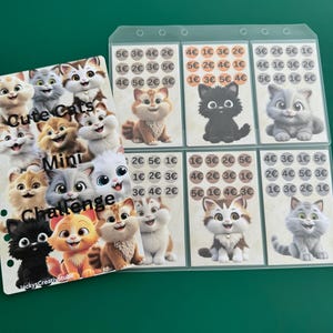 Könnte beinhalten: Ein Satz von neun bunten Karten mit Comic-Katzen, auf denen verschiedene Münzbeträge aufgedruckt sind. Die Karten sind mit "Cute Cats Mini Challenge" beschriftet.