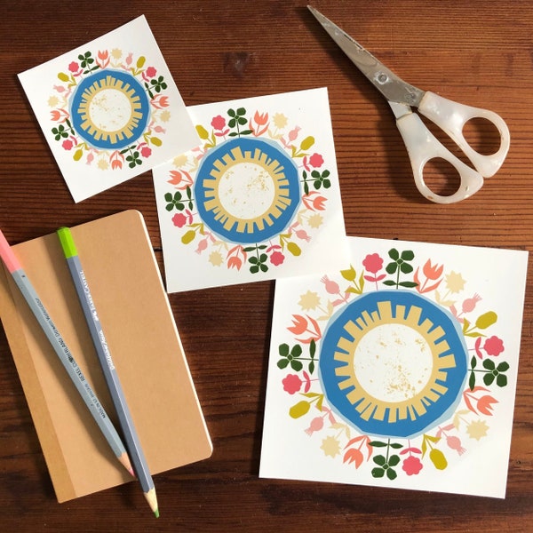 Whimsical Earth Vinyl Sticker, featuring hand-drawn design with playful flowers in shades of pink, orange, mustard, blue and green.