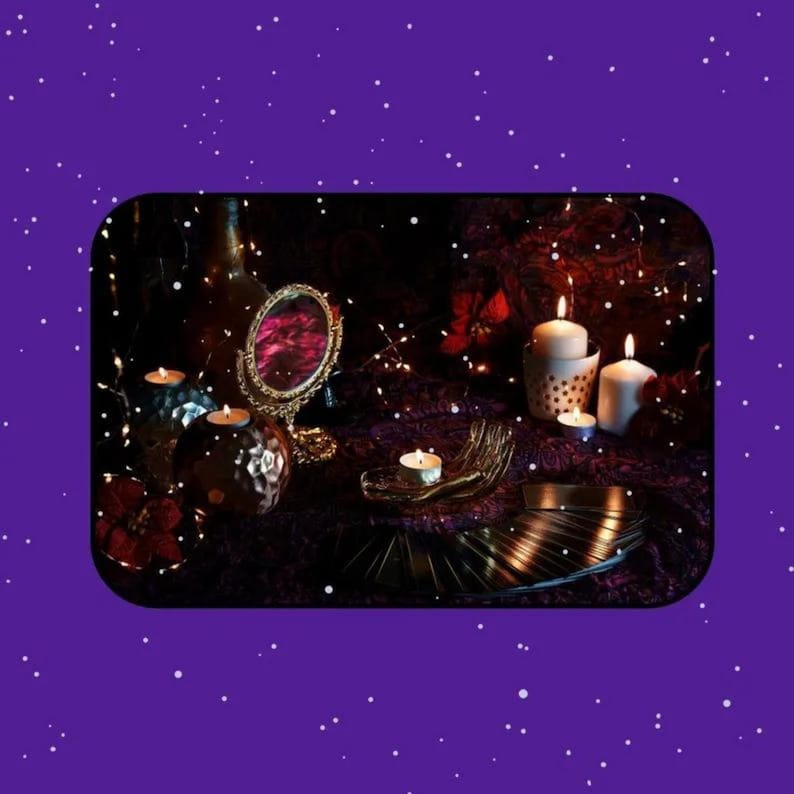 Mystical tarot reading setup with lit candles, a decorative mirror, an open palm, and a spread of tarot cards on a dark altar, framed by a purple starry background. This atmospheric image represents a psychic medium offering intuitive tarot reading and future reading, symbolizing spiritual guidance, insight, and connection to higher wisdom.