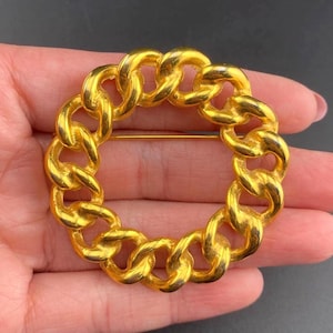 Spilla vintage a forma di cerchio placcata in oro