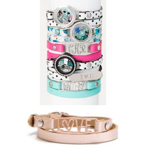 May include: A stack of wrap bracelets in various colors and designs. Some bracelets feature charms with floral and skull designs, initials, and the words "Mom", "Faith", and "I U". The text "IT'S A WRAP! CREATE YOUR OWN STYLE! IT'S ALL ABOUT YOU!" is at the top.