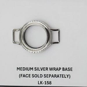 May include: A collection of jewelry components, including silver, gold, and rose gold bangle and wrap bases. Each base has a circular design with attachment points. Text on the image indicates the bases are sold separately from the faces.