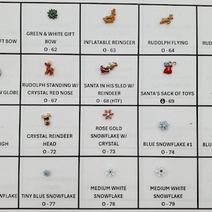 May include: A collection of small Christmas-themed charms and embellishments. Includes a green gift bow, reindeer, snowflakes, Santa, and a snow globe. Each charm has a corresponding number.