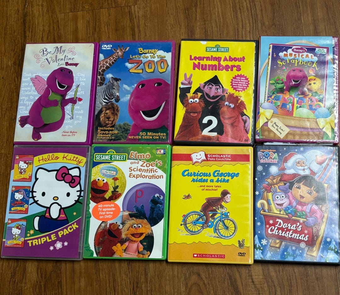 8 Children’s Dvd’s Including Barney, Sesame Street, Hello Kitty ...
