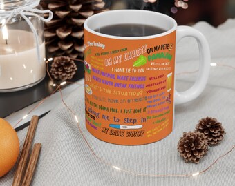 May include: Orange and white ceramic mug with a colorful design featuring text from the TV show 'Father Ted'. The text includes phrases like 'Oh My Christ!', 'Make Friends, Make Friends', 'What's the Situation?', 'I Just Love It', and 'My Balls Work!'