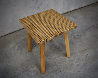 Side Table Made from Recycled Skateboards with Colorful Stripes and Wooden Legs