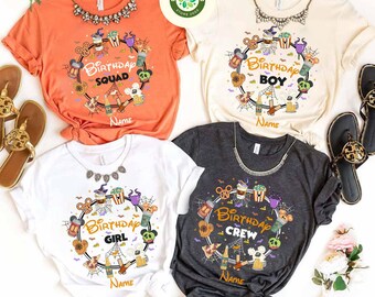 May include: Four short-sleeved t-shirts in orange, cream, white, and charcoal gray. Each shirt features a circular design with the words "Birthday Squad", "Birthday Boy", "Birthday Girl", and "Birthday Crew". The designs include cartoon graphics and the word "Name".