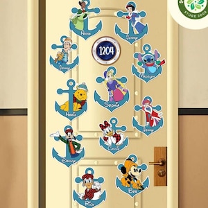 May include: A set of 12 blue anchor-shaped door hangers featuring various Disney characters, including Winnie the Pooh, Stitch, and Mickey Mouse. Each hanger has a name written below the character. The door hangers are decorated with a blue and white nautical theme. The number 1204 is written on a blue circle in the centre of the door.