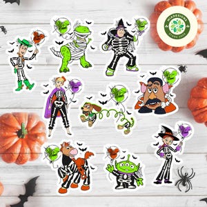 May include: A collection of Halloween-themed stickers featuring characters dressed in skeleton costumes. The stickers include a dinosaur wrapped in bandages, a green alien, and a horse with zebra stripes. Each character holds a balloon with a spider web design.