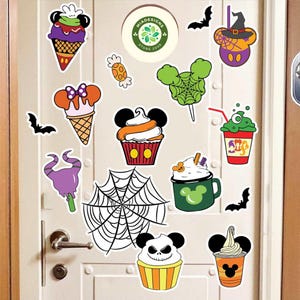 May include: A collection of colorful Halloween-themed stickers featuring Mickey Mouse ears and various treats. Designs include ice cream cones, cupcakes, a witch hat, and a spider web. The stickers are in shades of orange, purple, green, and black.