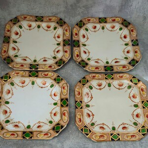 May include: A white ceramic mug with a black handle and the text "But First, Coffee" in a bold, black font. The mug is set against a blurred background, suggesting a cosy setting.