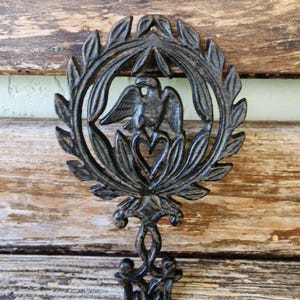 Vintage Wilton Black Cast Iron Trivet with Eagle and Heart