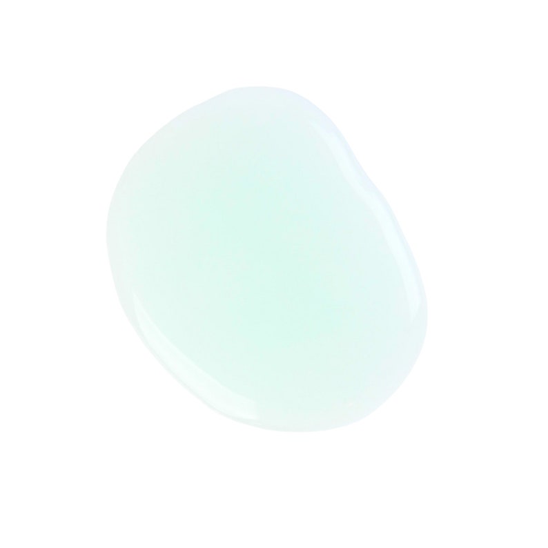 May include: A light green, translucent, liquid drop on a white background.